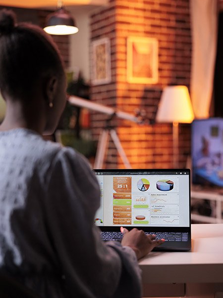 a young african woman preparing a financial presentation