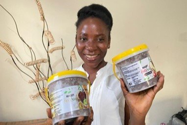 Gifty, a beautician who produces luscious and healthy black soap bathing products