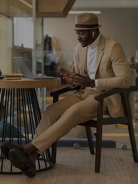 A young african man carrying out an online meeting